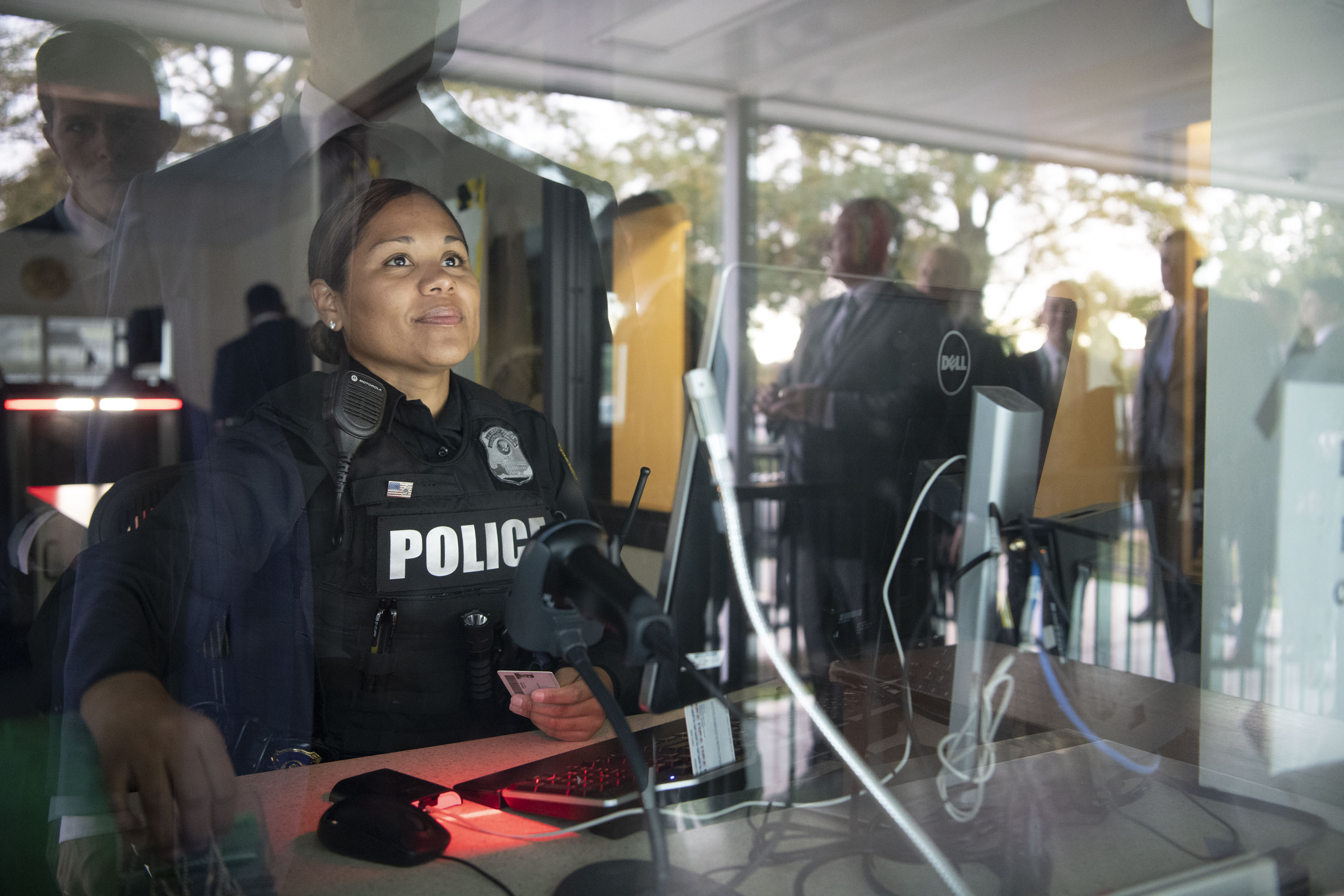 Female Secret Service Uniformed Division Officer sitting at a security station