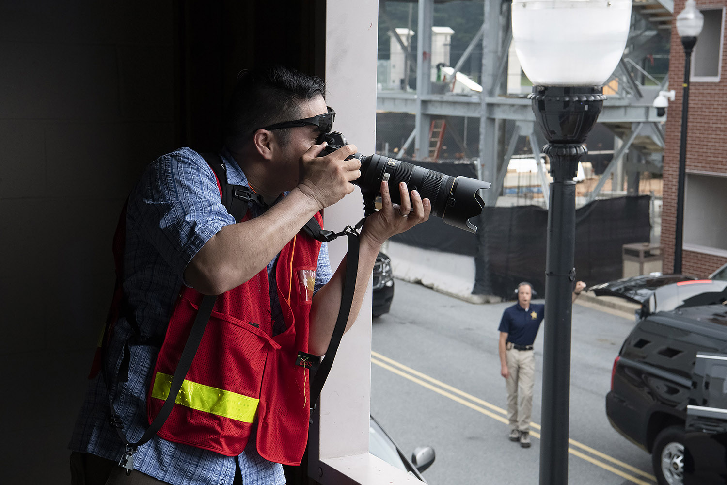 Photographer taking a picture of a training exercise.