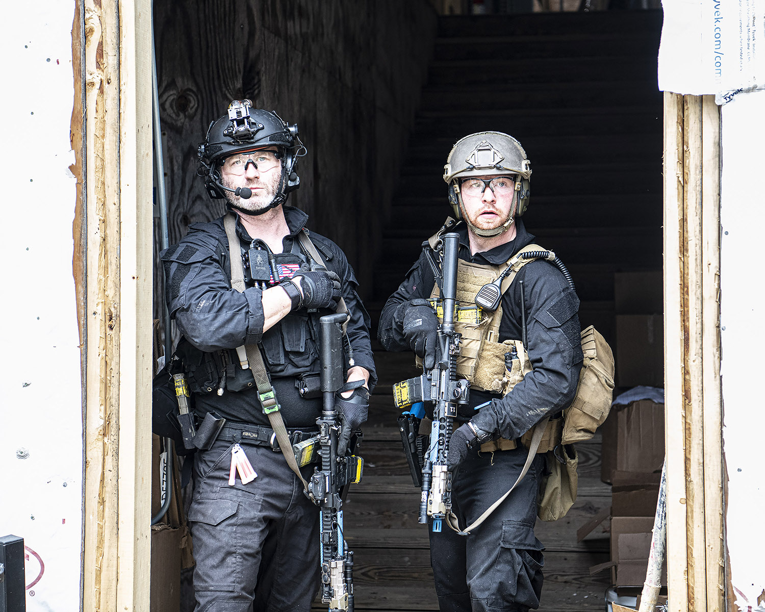 Two Special Agents in tactical gear.