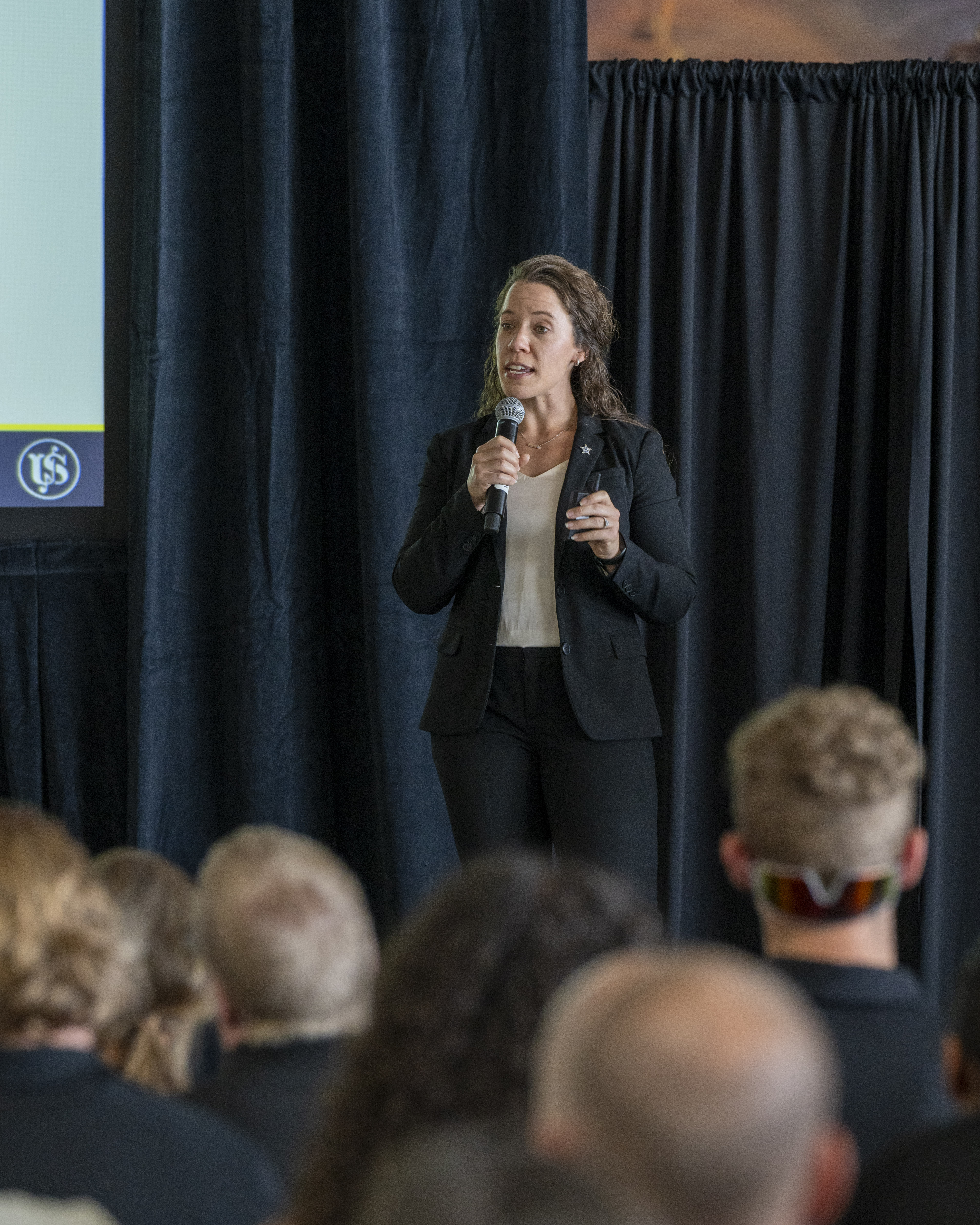 Supervisory Social Science Research Specialist Ashley Smolinski, of National Threat Assessment Center, discusses “Behavioral Threat Assessment: A Framework to Prevent Targeted Violence,” during a session at the Violence Prevention Symposium.