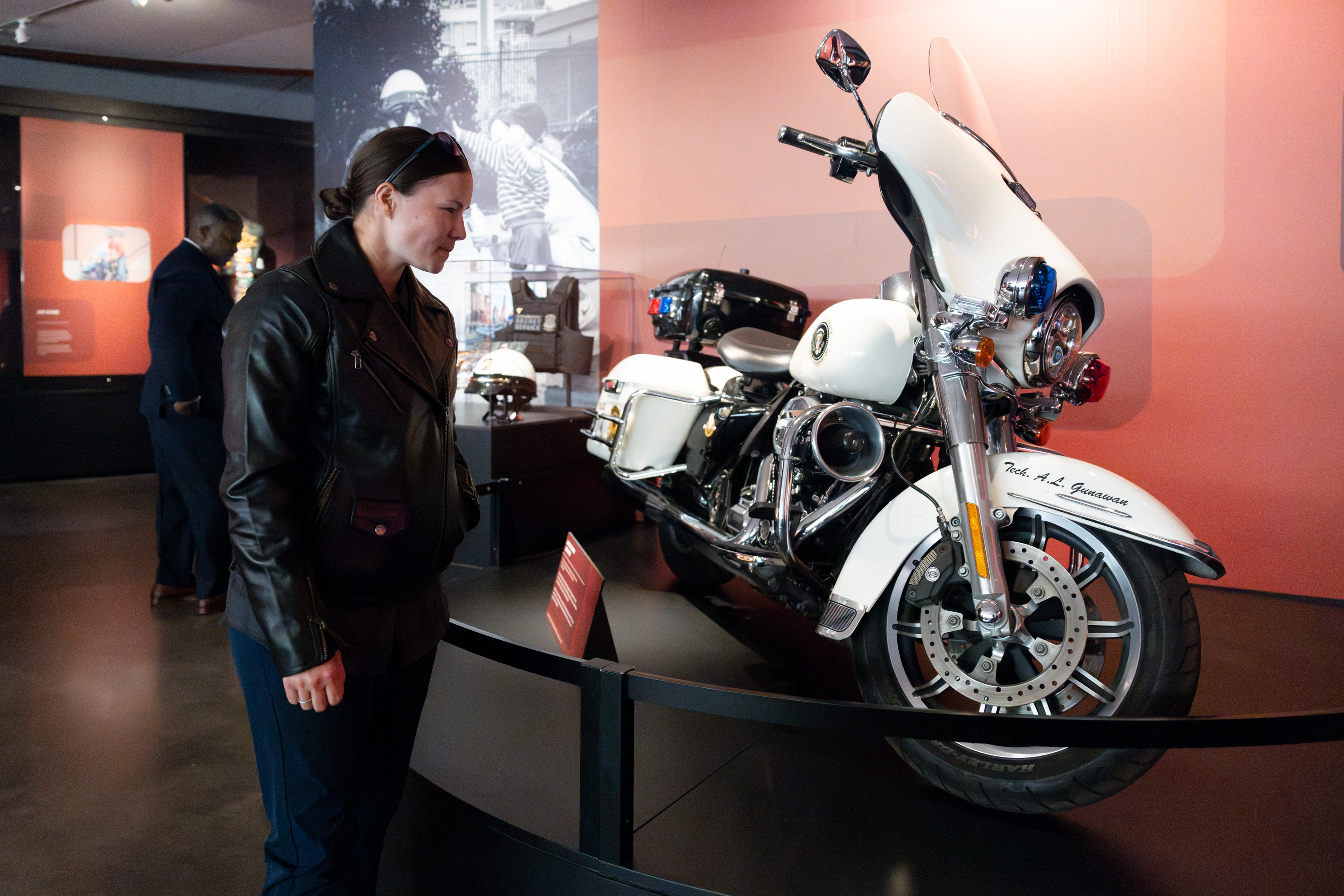 Officer Lauren Gunawan and the 2016 FLHTPI she used to ride on display at the Harley-Davidson Museum.