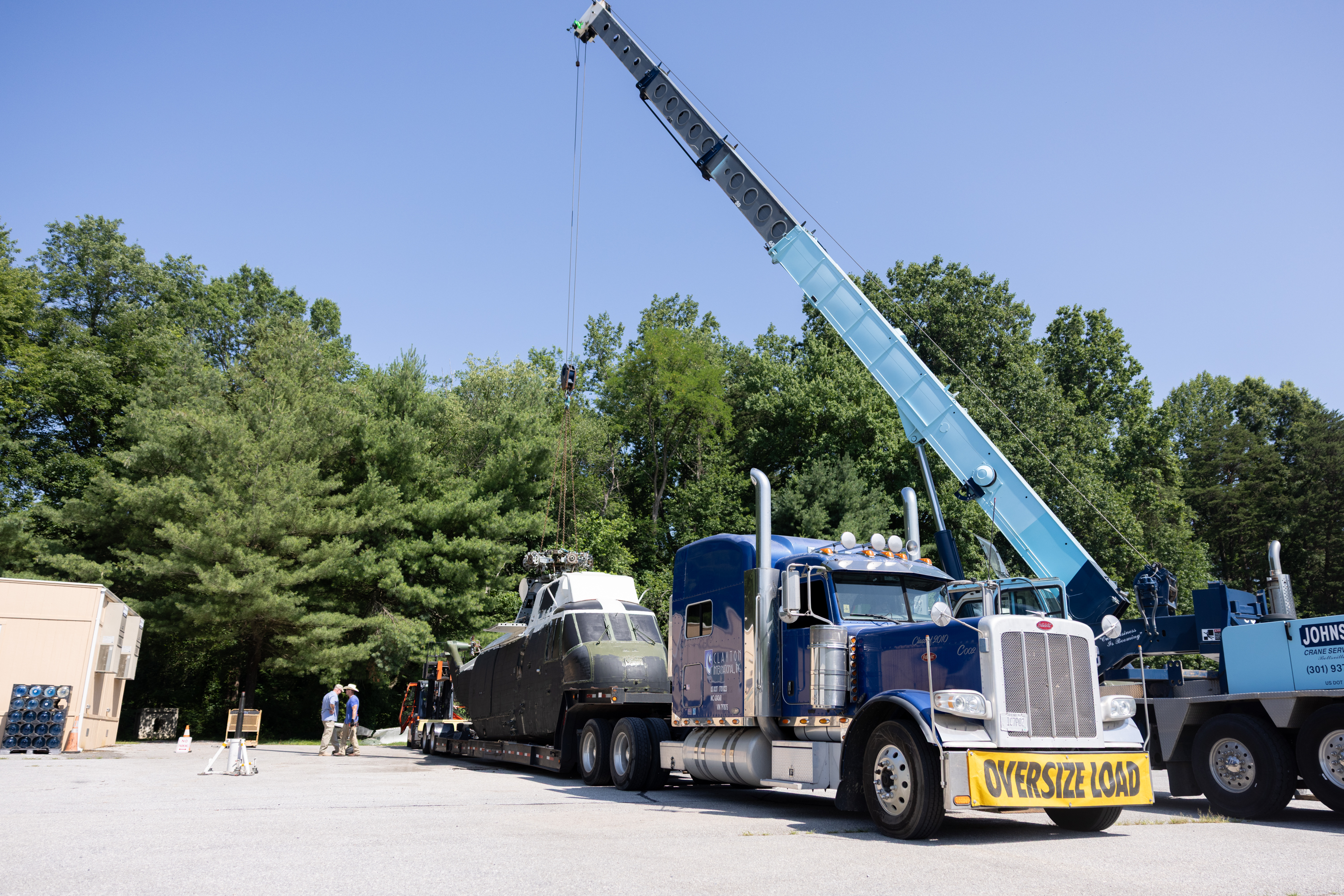 The former mock Marine One is loaded on a flatbed for removal.
