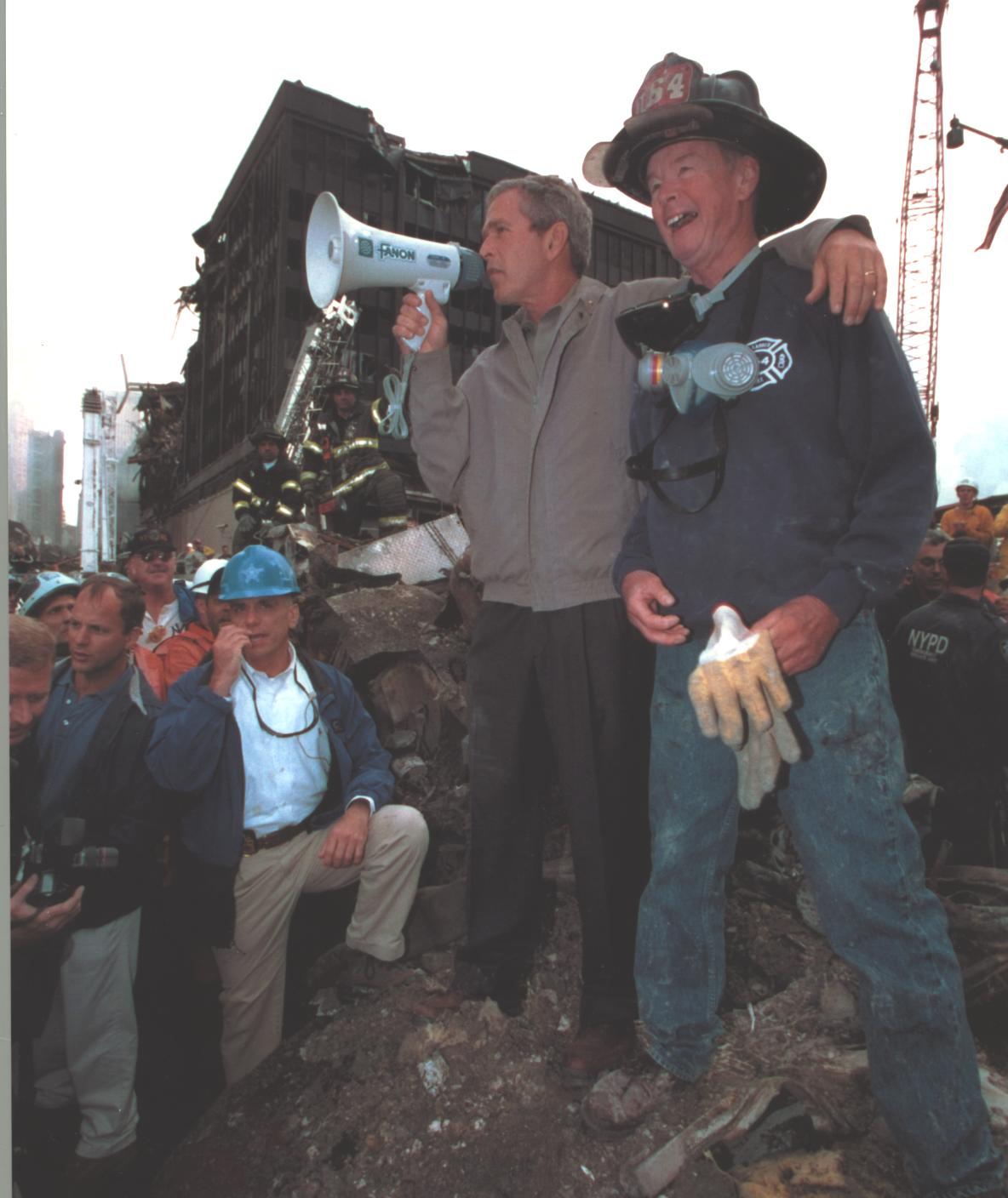 Secret Service agents stand with President Bush on Sept. 14 at Ground Zero. 