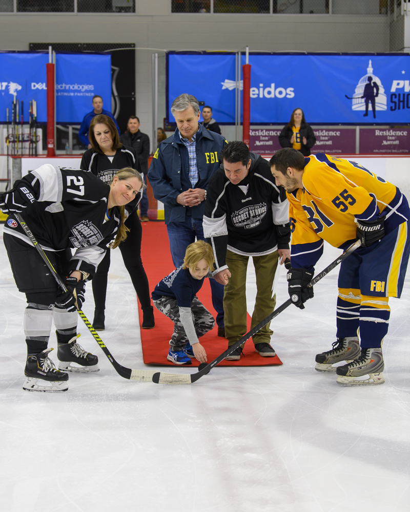 Secret Service Director Kimberly Cheatle and FBI Director Christopher Wray oversee the ceremonial puck drop. 