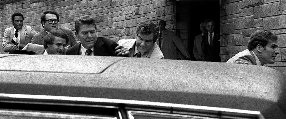 Secret Service personnel react during an assassination attempt of then-President Ronald Reagan March 30, 1981.